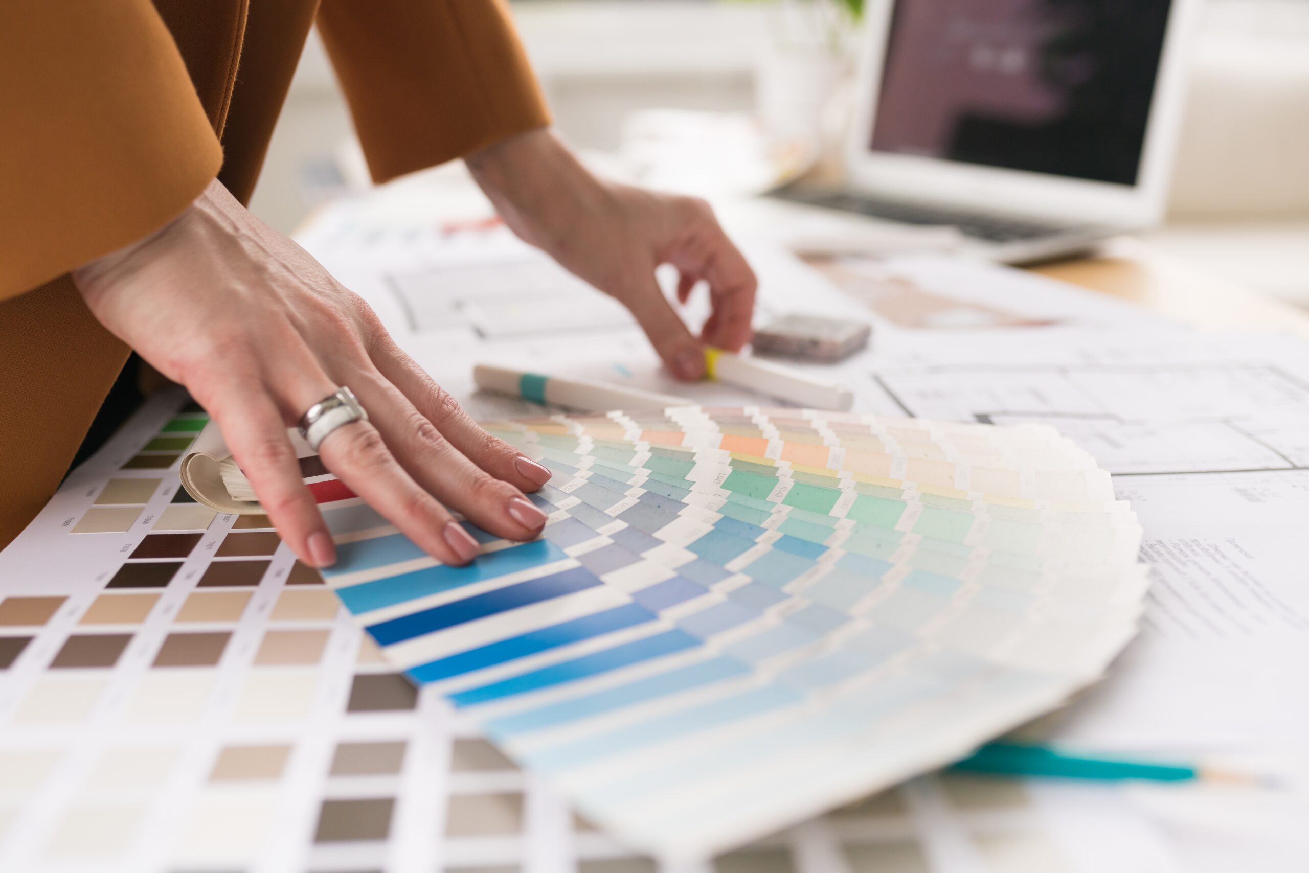 Women looking through colors during a paint color consultation.